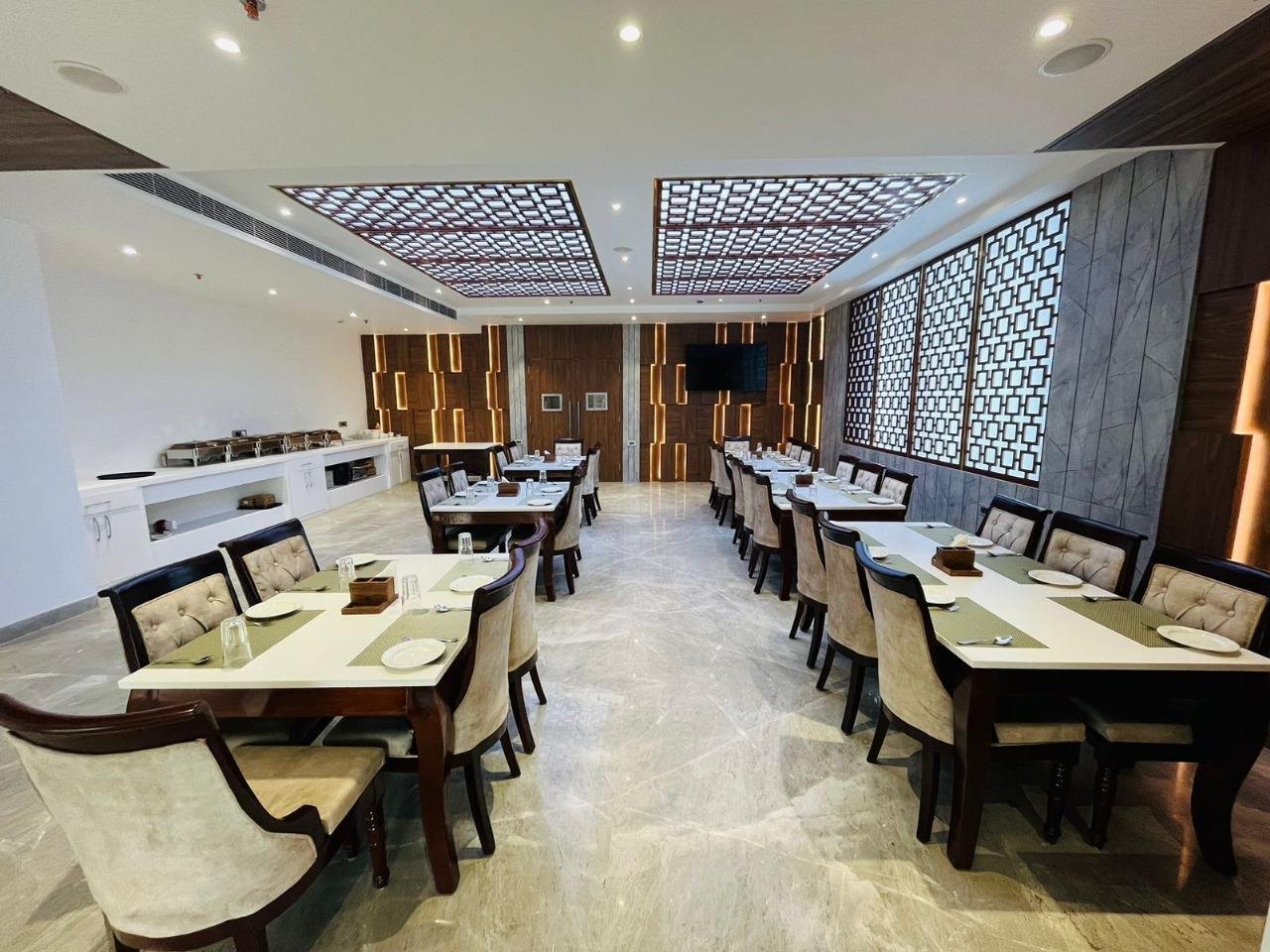 The Royal Legacy Fine Dining Restaurant with Backlit Ceilings and Laid Tables